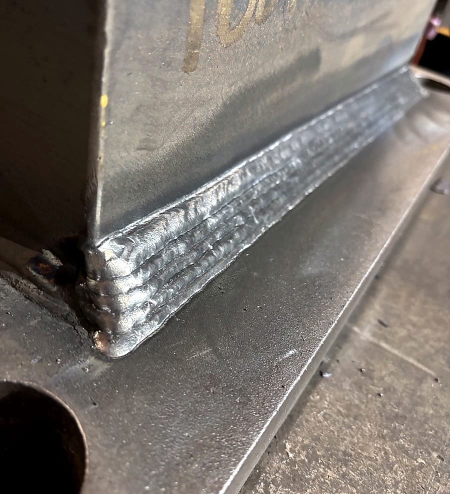 A long fillet weld running the length of a plate joint.