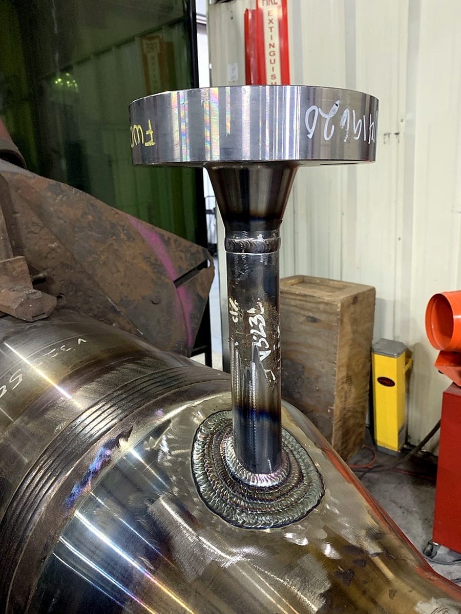 A second nozzle-to-shell weld seen from the opposite side of the assembly.