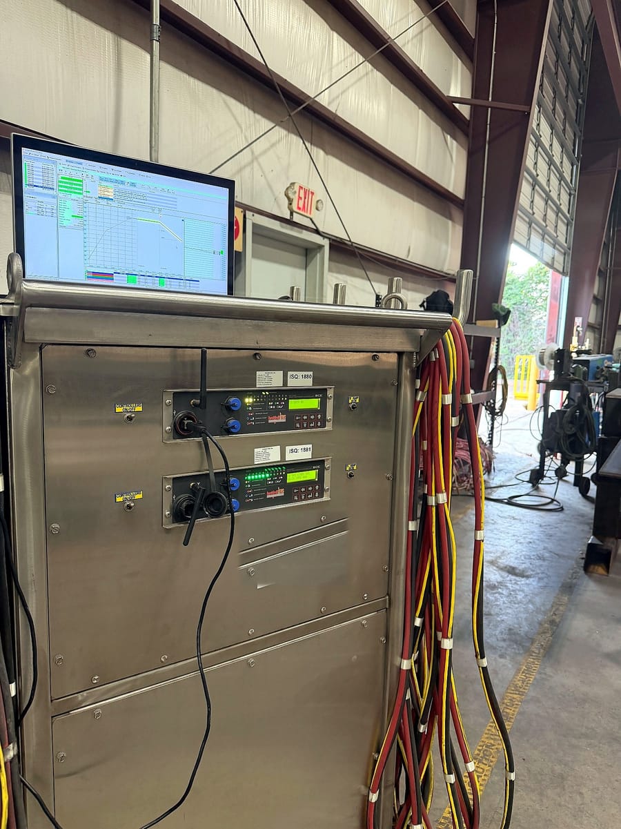 The heat treatment control console, two programmable channels running.